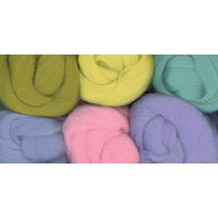 Assorted colorful yarn balls on a white background