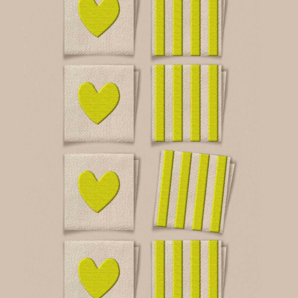 Set of green heart and striped patterned labels on a beige background