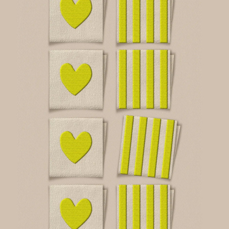 Set of green heart and striped patterned labels on a beige background