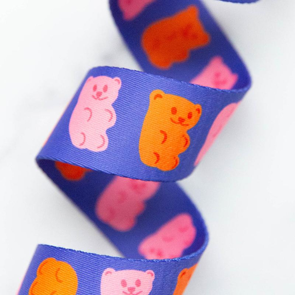 Blue webbing with pink and orange gummy bear pattern