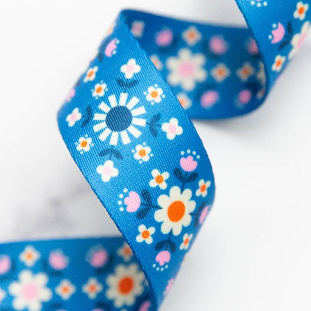 Bright blue floral webbing on white background