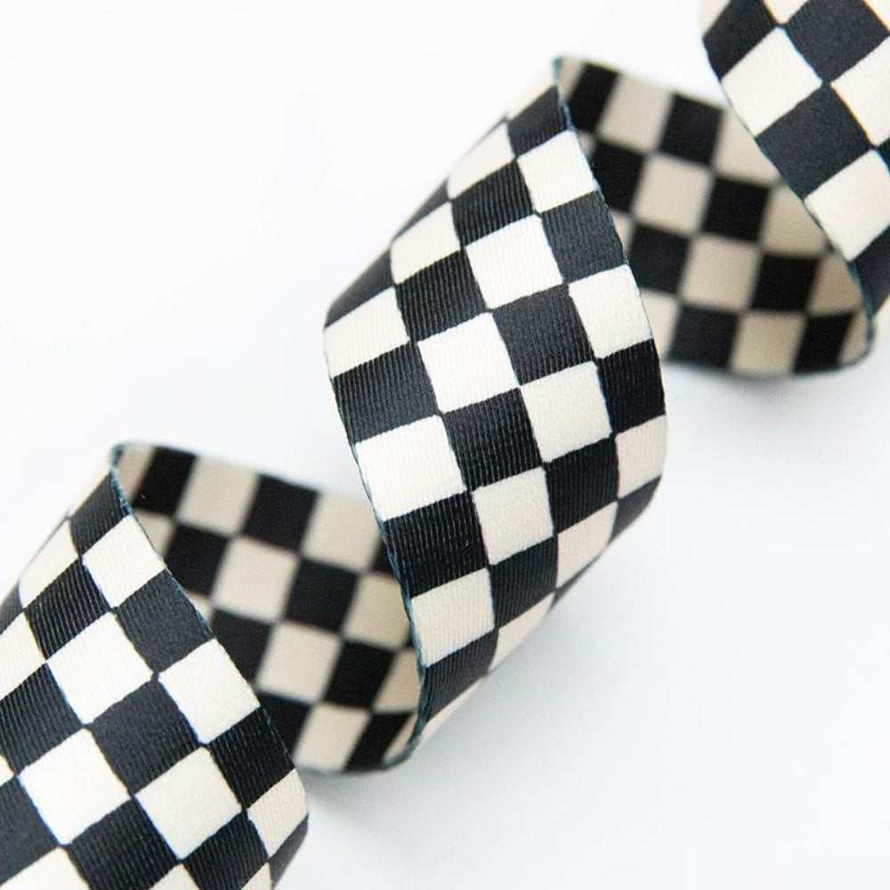 Black and white checkered webbing on a white background
