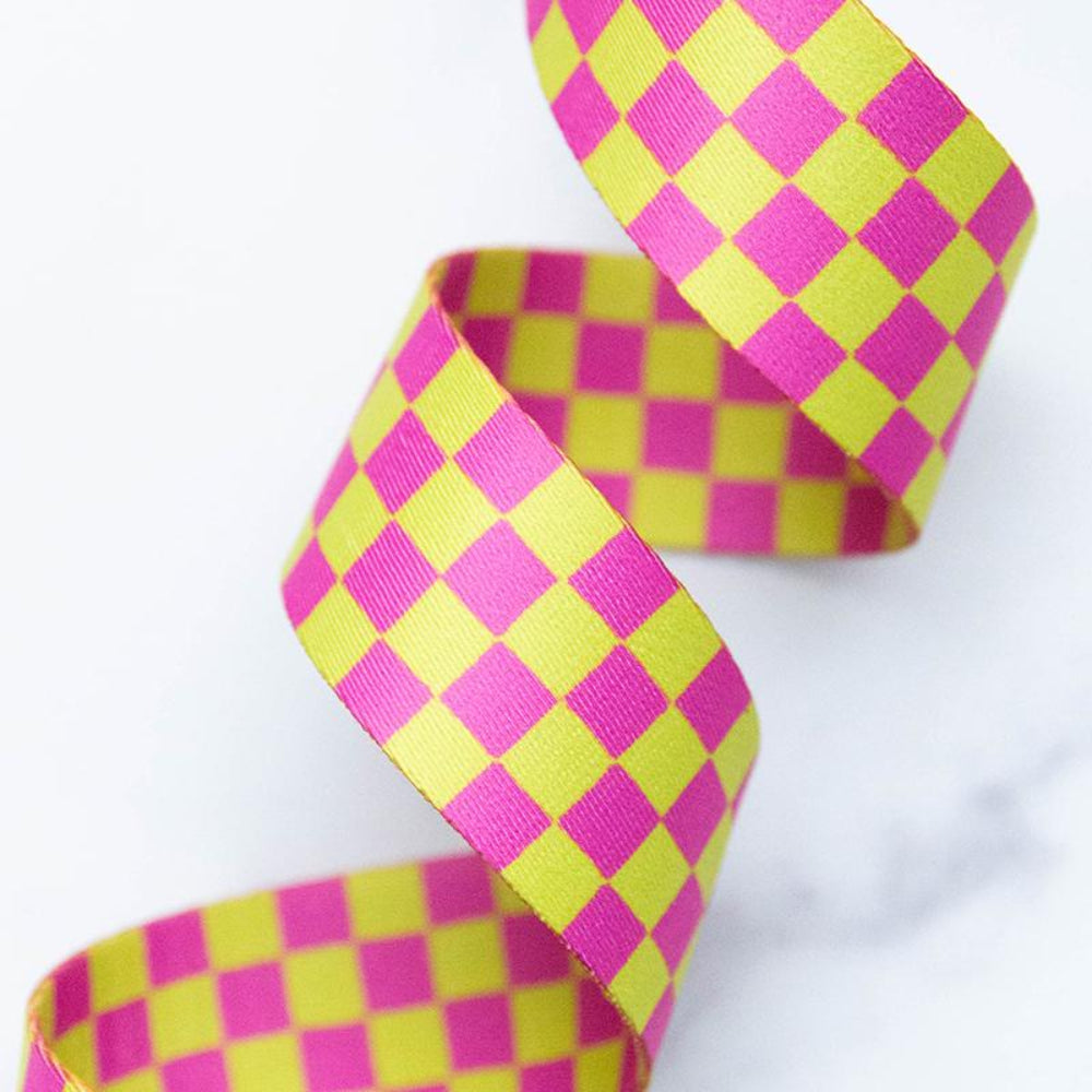 Pink and green checkered webbing on a white background