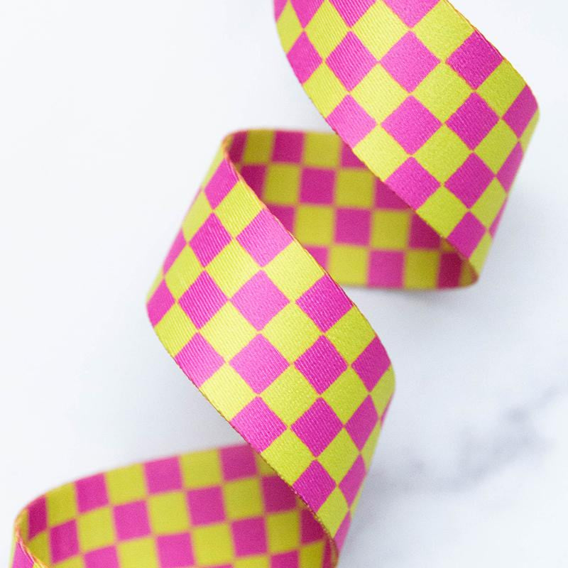 Pink and green checkered webbing on a white background