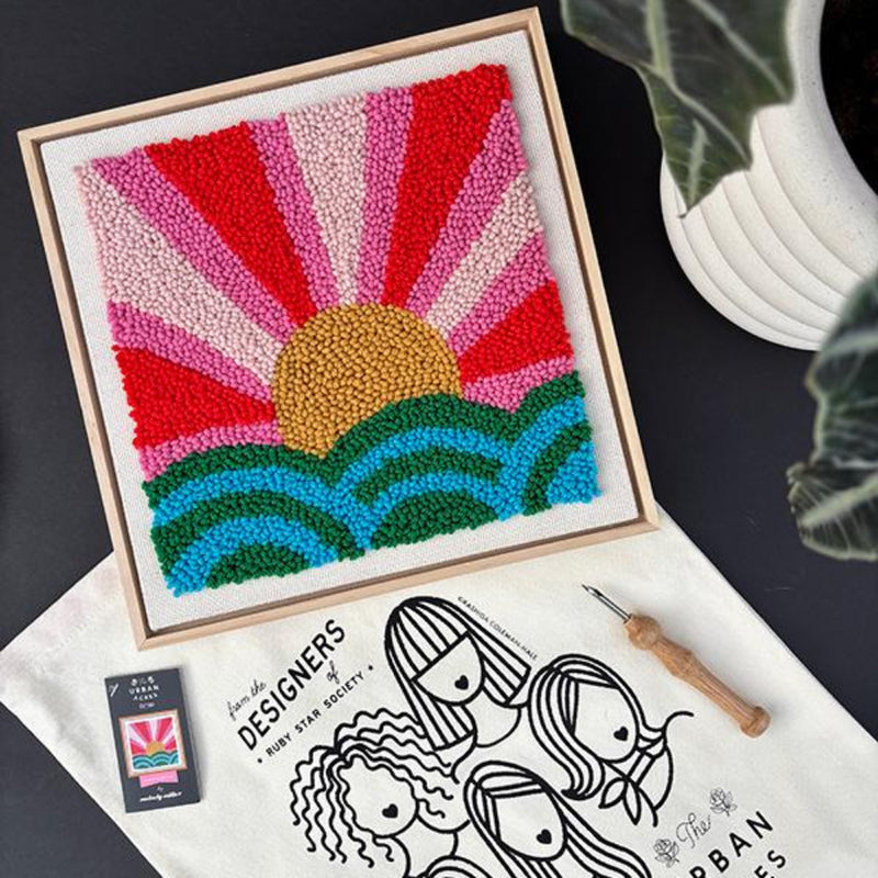 Framed colorful sun and wave punch needle design