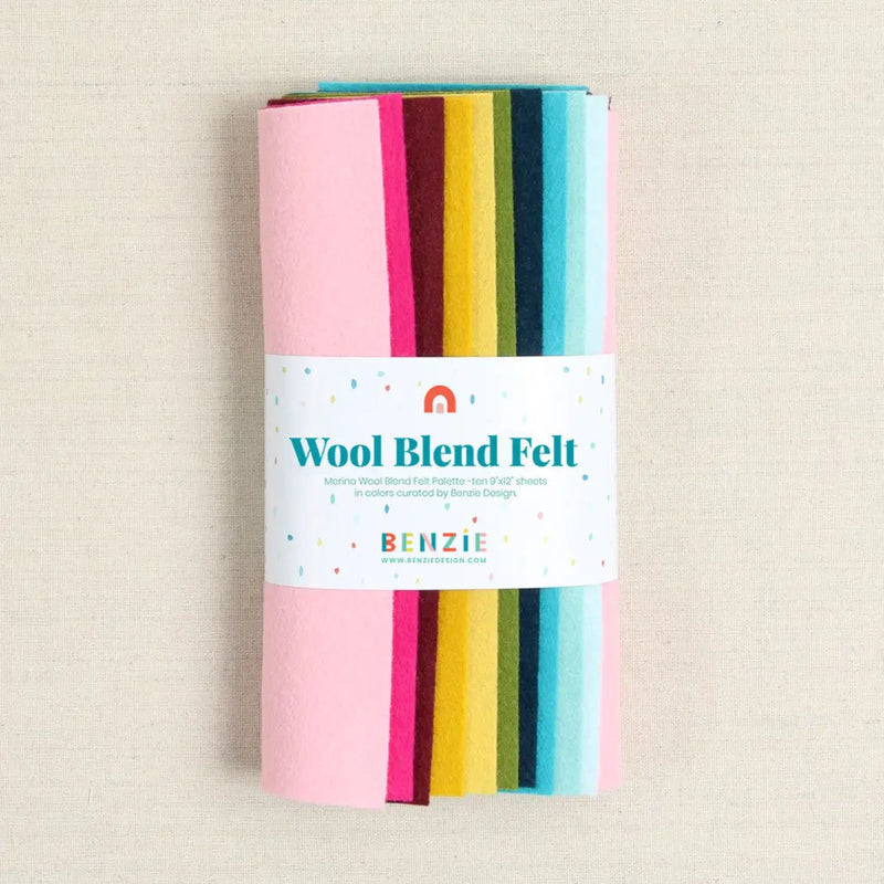 Pack of wool blend felt with colorful strips on a beige background