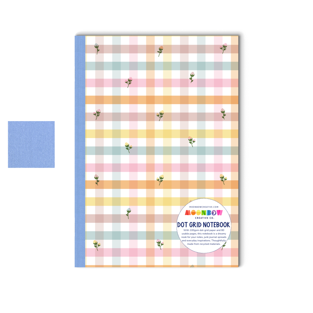 Notebook with pastel checkered cover and blue spine on a white background