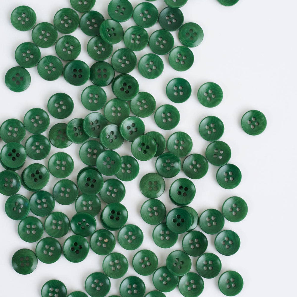 Green buttons scattered on a white background