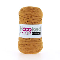 Ball of mustard yellow yarn with a 'Hooked' label on a white background