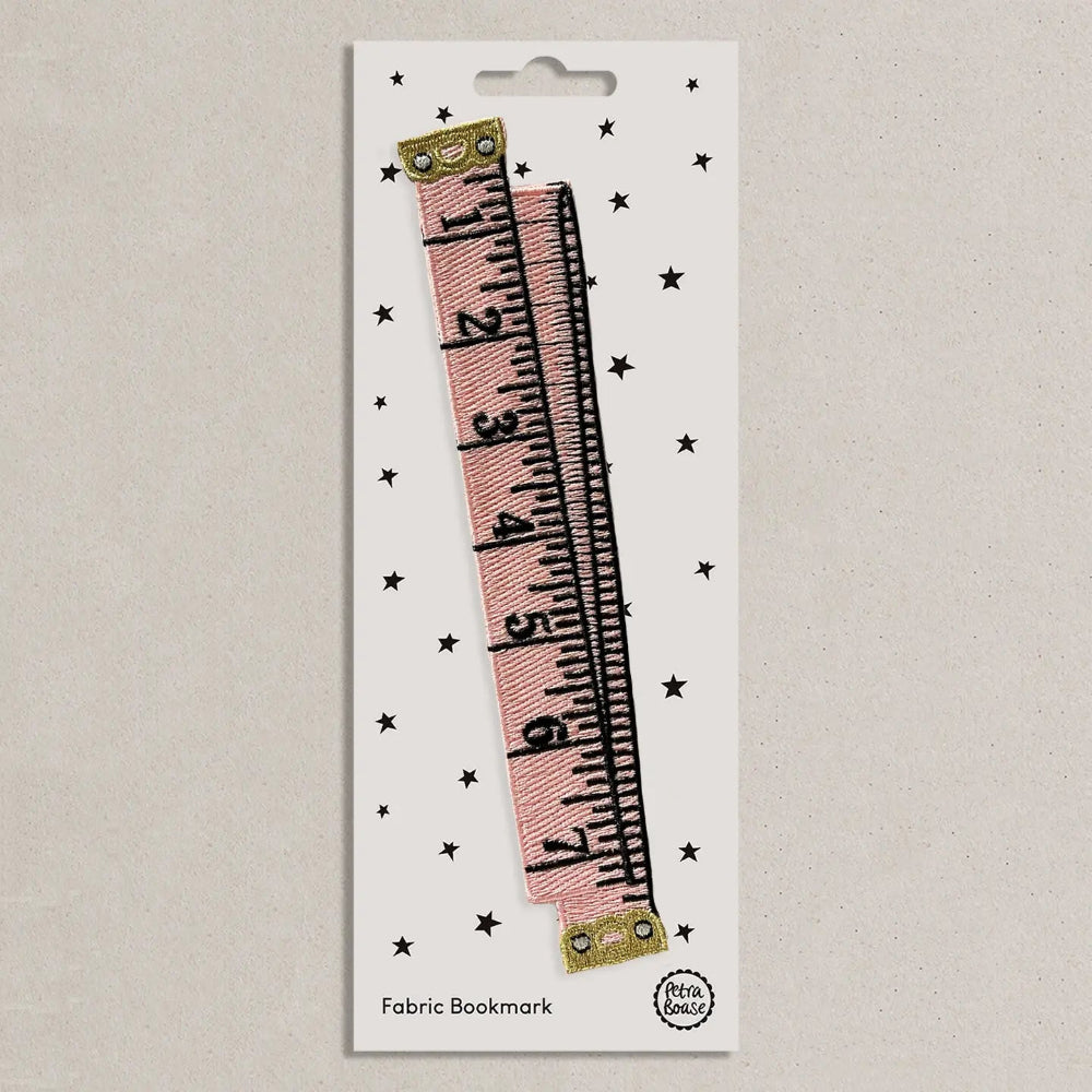 Fabric bookmark with ruler design on a white card with star patterns