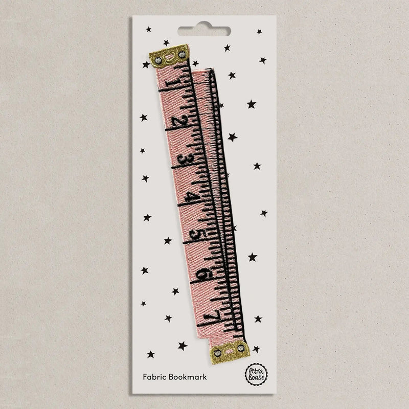 Fabric bookmark with ruler design on a white card with star patterns