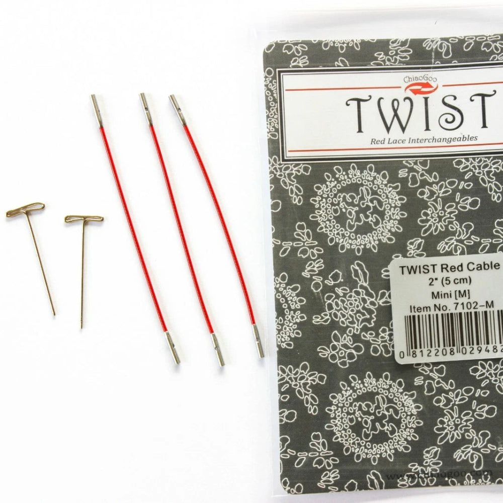 Packaged red cable with metal pins on a white background