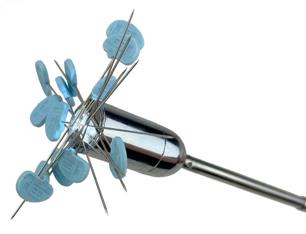 Metallic tool with blue pins on a white background