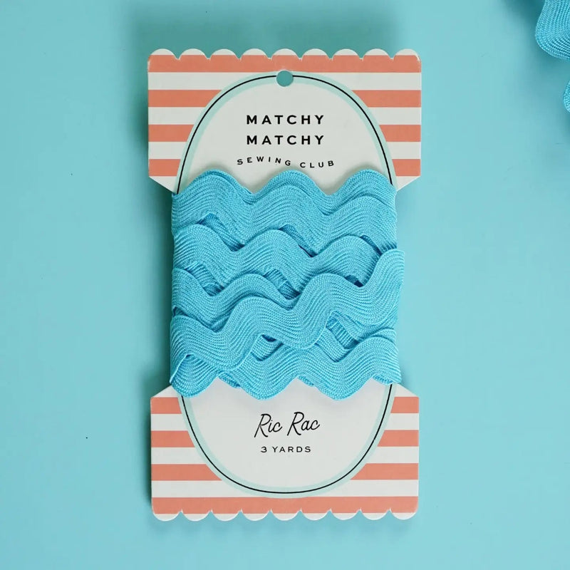 Blue ric rac on a striped packaging with a blue background
