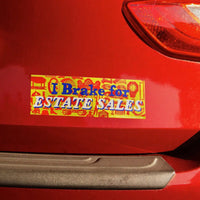 Bumper sticker on a red car reading 'I Brake for Estate Sales'.
