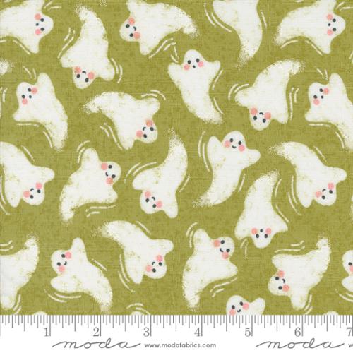 Smiling ghosts on green background
