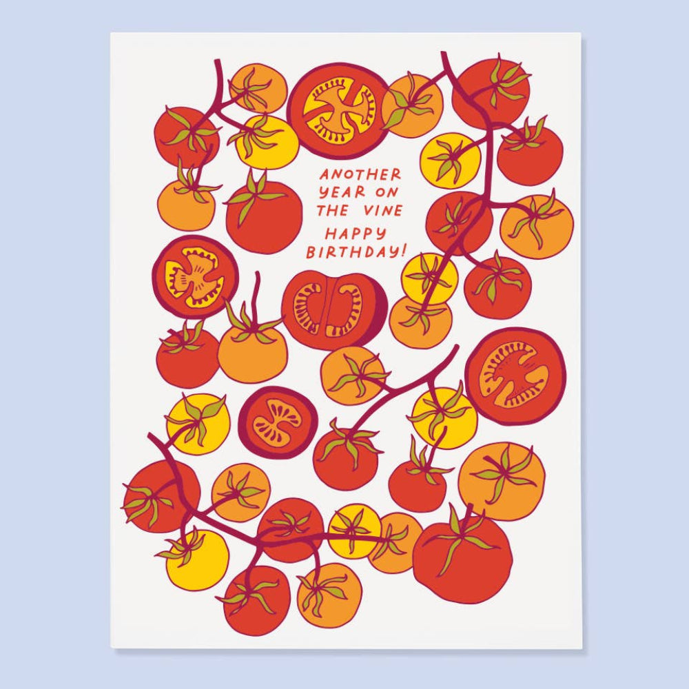 Birthday card with tomato design and text on a light blue background