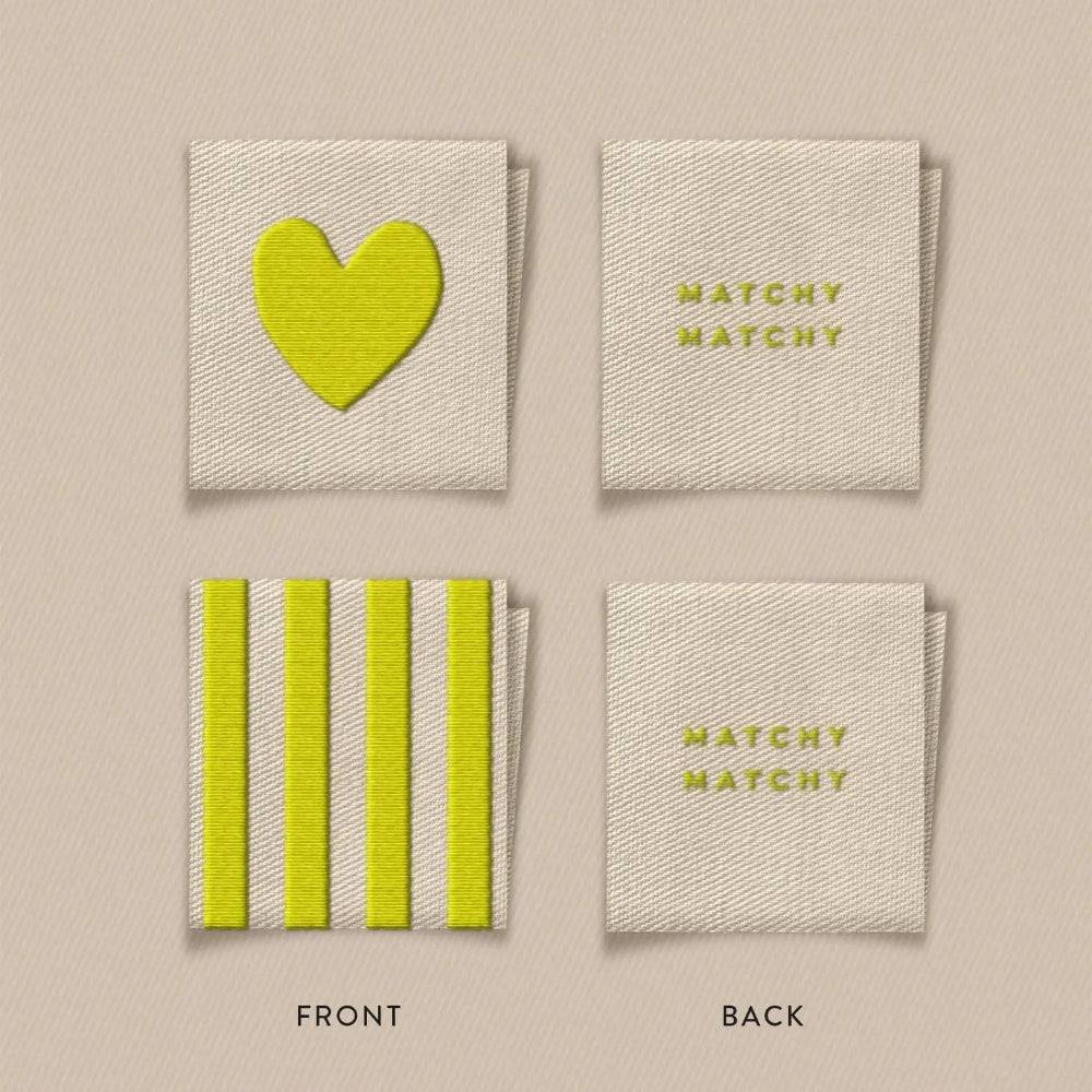 Front and back view of the labels with a heart or stripes on the front and Matchy Matchy written on the back