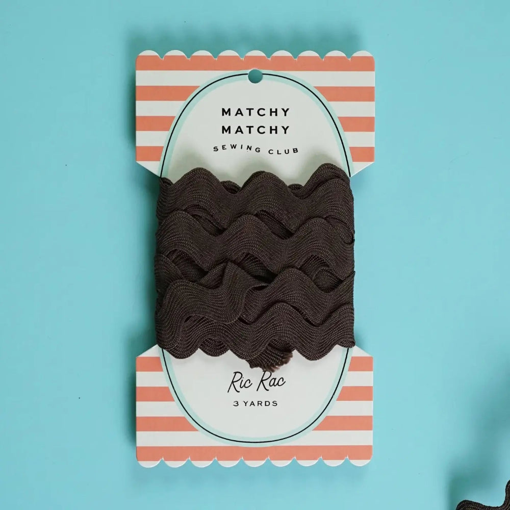 Packaged brown ric rac on a striped card with 'Matchy Matchy Sewing Club' branding on a blue background.