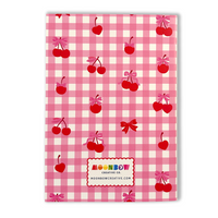 Notebook with pink gingham pattern, red cherries, and bows on a white background. Brand 'Moonbow Creative Co.' visible.