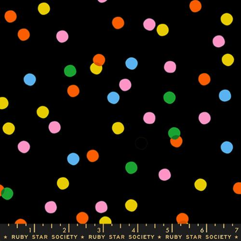 Black fabric swatch with rainbow polka dots scattered throughout 