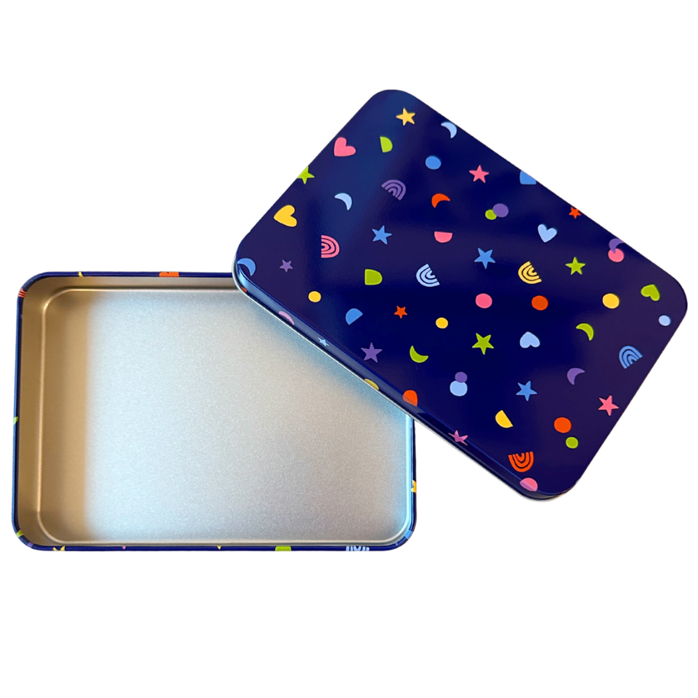 Colorful patterned tin box with a metallic interior on a white background