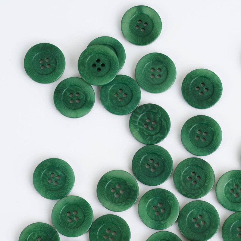 Green buttons scattered on a white background