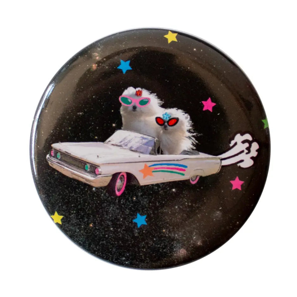 Buttong with 2 white dogs wearing sunglasses in a white car floating through space.