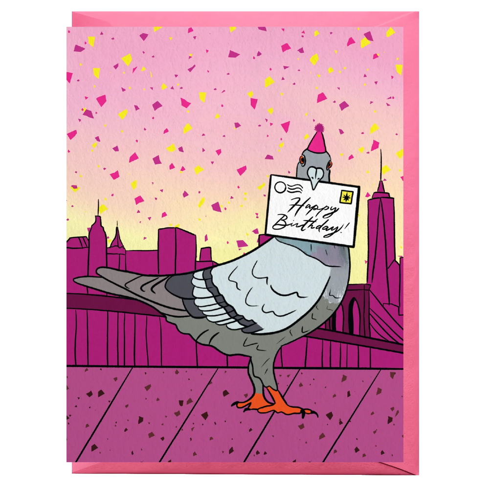 A pink birthday card featuring a cartoon pigeon standing on a bridge with a city skyline in the background and confetti in the sky. The pigeon holds a card that says 'Happy Birthday!'.