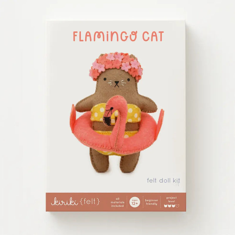 Flamingo cat felt doll kit packaging with a brown cat-like character holding a pink flamingo and wearing a flower crown.