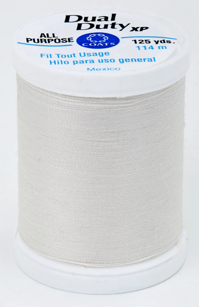 Spool of Coats Dual Duty XP thread on a white background