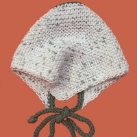 Knitted bandana on an orange background.