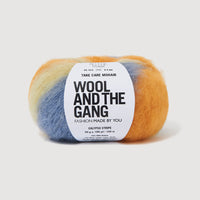 Multicolored yarn skein with 'Wool and the Gang' label on a white background