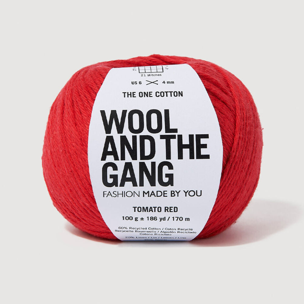 Red ball of yarn with 'Wool and the Gang' label on a light gray background