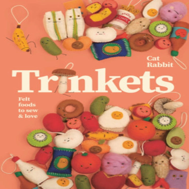 coral colored book cover of "trinkets" with felt foods scattered about