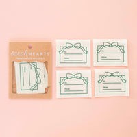 Pack of 'sarah hearts' premium sew-in labels on a pink background