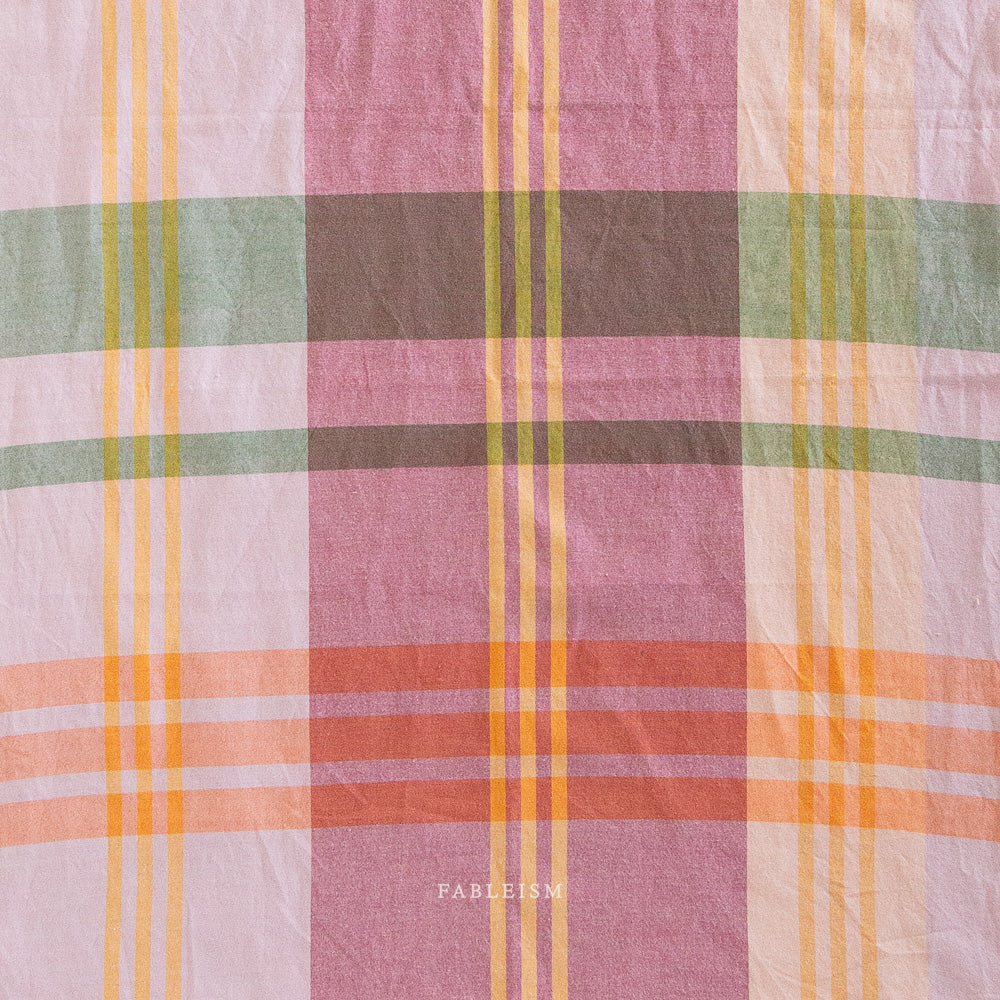 Plaid fabric with pastel yellow, pink colors 