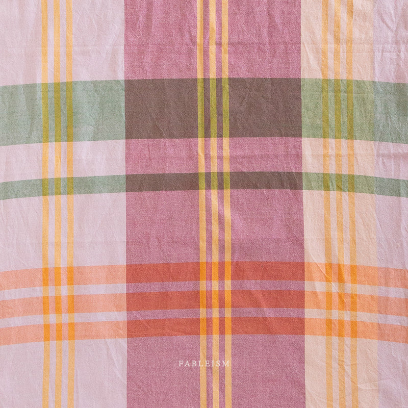 Plaid fabric with pastel yellow, pink colors 