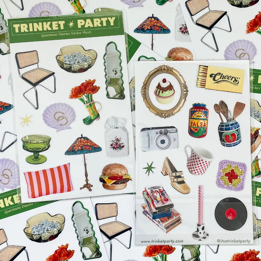 2 sheets of stickers with items you would find in an apartment: coaster, mug, shoe, mirror, table lamp, vase with flowers, books, pillow, hamburger, etc
