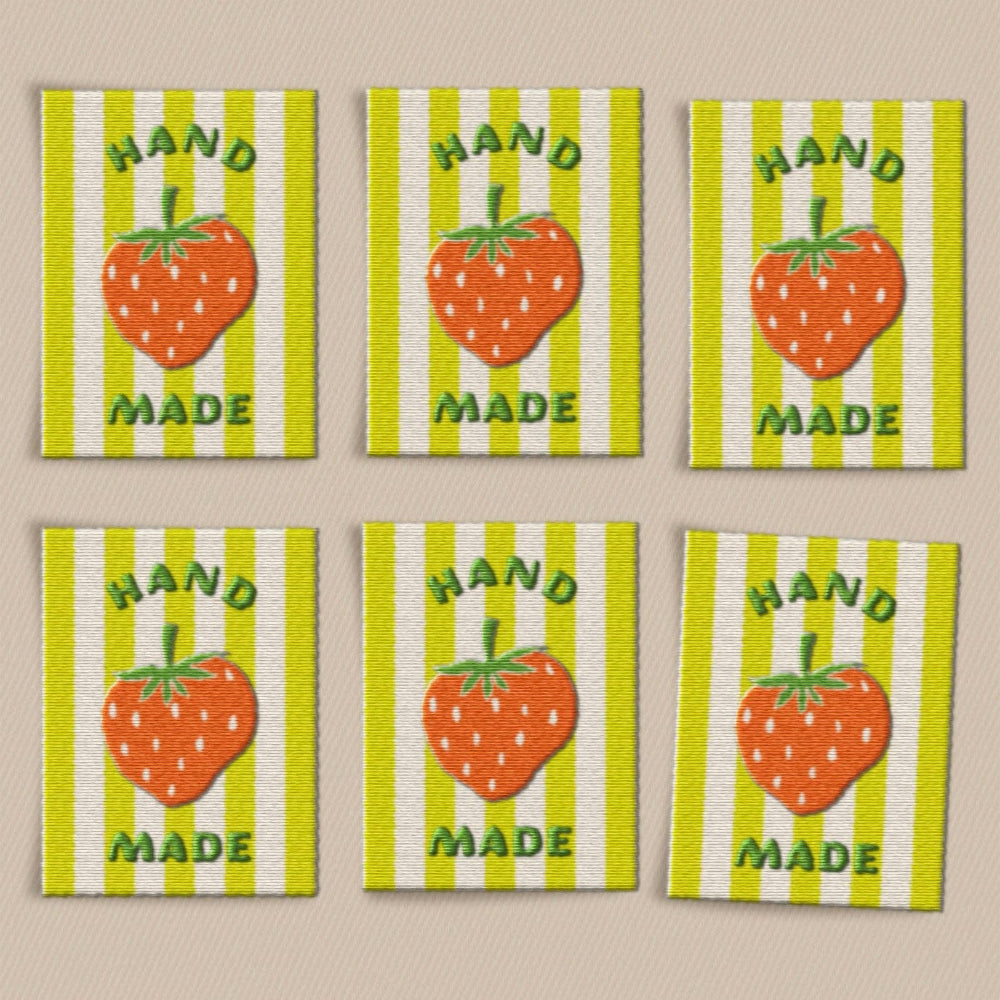 Six labels with strawberry design and 'Hand Made' text on a striped background.