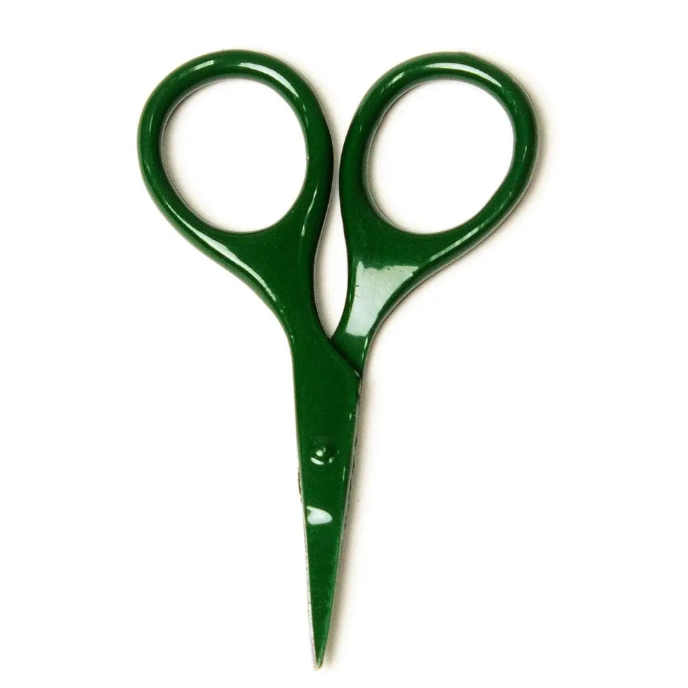 Green scissors on a white background