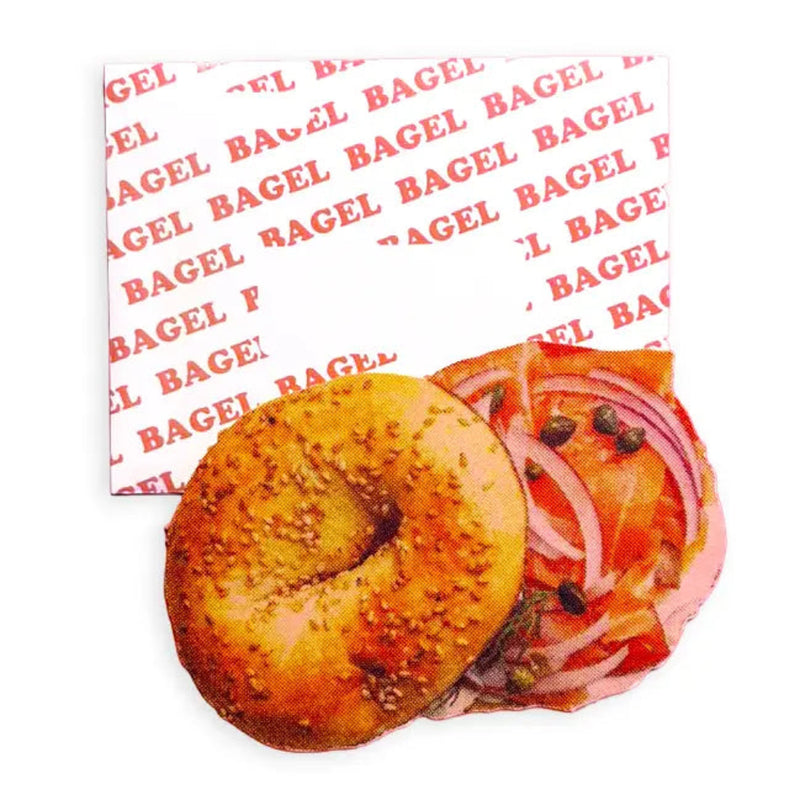 Bagel with toppings on a branded paper with 'Bagel' text.