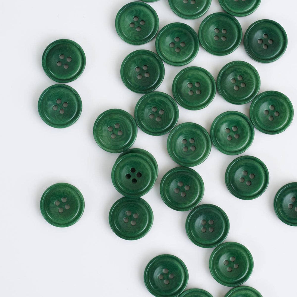 Green buttons scattered on a white background