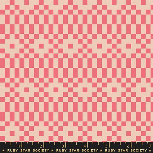 Fabric with a pixelated geometric pattern in neon coral and tan.