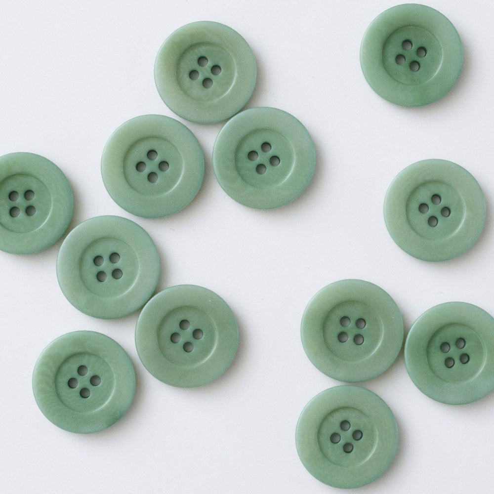 Green buttons on a white background