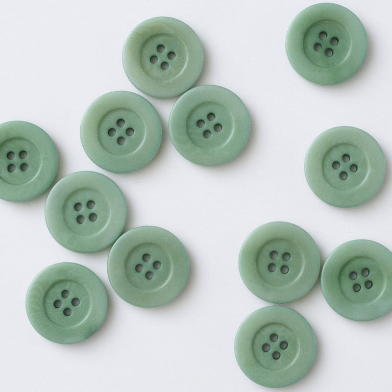Green buttons on a white background