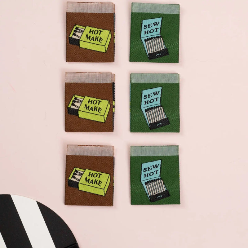 2 sets of matches woven on labels on a beige background