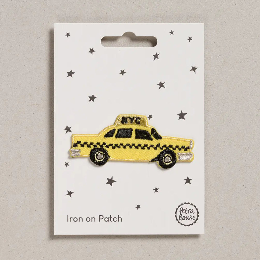 yellow taxi patch on white packaging 