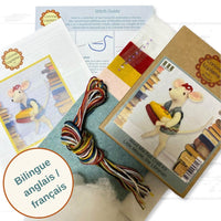Craft kit with mouse toy, thread bundle, and instruction manual on a white background