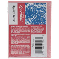 Pink carving block in plastic packaging with the brand name "Speedball" on it.